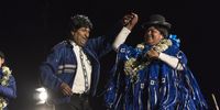 Evo Morales, Bolivia's president, left, dances on stage during a campaign rally in El Alto, Bolivia, on Wednesday, Oct. 16, 2019. Morales is facing his toughest re-election campaign yet ahead of a first round Oct. 20 vote. Photographer: Marcelo Perez del Carpio/Bloomberg via Getty Images