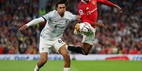 Trent Alexander-Arnold of Liverpool battles for possession with Anthony Elanga of Manchester United during the Premier League match between Manchester United and Liverpool FC at Old Trafford on August 22, 2022 in Manchester, England. (Photo by Clive Brunskill/Getty Images)