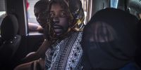 Three foreign nationals sit on the back seat of a van hours after the attack on 8 March. They were later dropped off at the Diakonia Centre where many spent the night. (Photo: Shiraaz Mohamed)