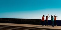 "Dancing in the Blue". A group of women dance against the blue Barcelona sky on a sunny Sunday morning, after the end of lockdown. © Davide Bonaldo, Italy, Shortlist, Open, Street Photography, 2022 Sony World Photography Awards