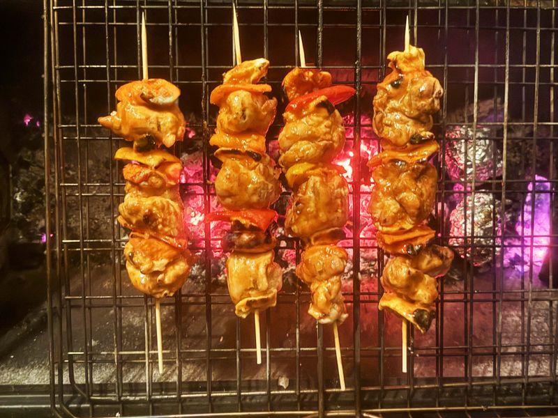 Deboned chicken thigh sosaties with dried fruit and a curried orange baste