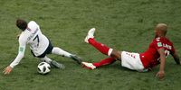 Antoine Griezmann of France (L) is tackled by Mathias Jorgensen of Denmark during the FIFA World Cup 2018 group C preliminary round soccer match between Denmark and France in Moscow, Russia, 26 June 2018. EPA-EFE/YURI KOCHETKOV