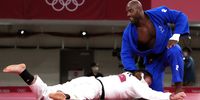 epaselect epa09382209 Aaron Wolf (white) of Japan and Teddy Riner (blue) of France compete during their men's +90kg bout of the Mixed Team Final at the Judo events of the Tokyo 2020 Olympic Games at the Nippon Budokan arena in Tokyo, Japan, 31 July 2021.  EPA-EFE/CHRISTOPHER JUE