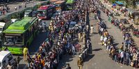 Crowds of migrant workers wait to board buses to return to their native villages as a nationwide lockdown continued in an attempt to stop the spread of Covid-19 on 28 March 2020 in Ghaziabad, on the outskirts New Delhi. (Photo: Yawar Nazir / Getty Images)