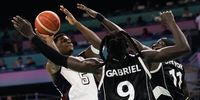 Anthony Edwards of USA (L) in action against Wenyen Gabriel of South Sudan (C) during the Mens Group C match between USA and South Sudan in the Paris 2024 Olympic Games, at the Pierre Mauroy Stadium in Villeneuve-d'Ascq, France, 31 July 2024.  EPA-EFE/ALEX PLAVEVSKI