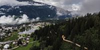 epa09333100 View of the world's longest treetop walk in Laax, Switzerland, 09 July 2021. The 'Senda dil Dragun' (Way of the Dragon) is 1.56 kilometres long and will be opened to the public on 11 July.  EPA-EFE/GIAN EHRENZELLER