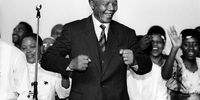 Nelson Mandela smiles as he attends an ANC victory march in 1994 in Johannesburg, South Africa. (Photo: Gallo Images / Paul Weinberg)