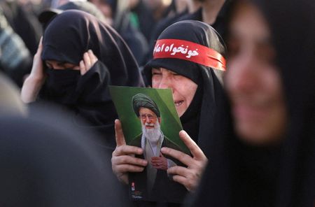 Slain Iranian leader buried as successor remains out of sight