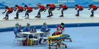 BEIJING, CHINA - JANUARY 29: Medical staff in personal protective kit chat as Norwegian speed skaters take part in a practice session at the National Speed Skating Oval on January 29, 2022 in Beijing, China. With less than one week to go until the opening ceremony of the Beijing 2022 Winter Olympics, Chinese authorities are making final preparations to try and ensure a successful Games amid the continuing Covid-19 coronavirus pandemic. (Photo by Carl Court/Getty Images)