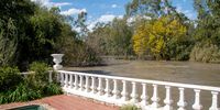 Floodwaters rise along the Vaal River after controlled releases from the Vaal Dam, reaching houses along the river in Parys. 30 April 2025. (Photo: Julia Evans)