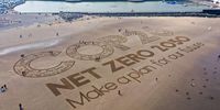 A giant sand artwork adorns New Brighton Beach in Wirral, Merseyside to highlight global warming and the COP26 global climate conference on 31 May 2021. (Photo: Christopher Furlong/Getty Images)