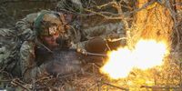 Members of the U.S. 173rd Airborne Brigade fire blanks from a machine gun during a simulated attack during the Iron Sword multinational military exercises on 24 November 2016 near Pabrade, Lithuania. About 4,000 soldiers from NATO countries, including all three Baltic states as well as the US, were participating in the two-week exercises. (Photo: Sean Gallup / Getty Images)