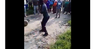 Video of a man set alight and beaten.