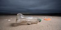 A plastic bottle and the remains of a child's spade lay on the beach on Earth Day in North Wales on April 22, 2024 in Prestatyn, United Kingdom. Earth day was first held on April 22, 1970 and has grown to incorporate 193 countries globally. The official theme for 2024 is "Planet vs. Plastics." (Photo by Christopher Furlong/Getty Images)
