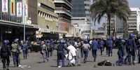 Injured demonstrators lie in a Harare street as a protest is driven back by riot police on 16 August 2019. The country’s main opposition party, Movement for Democratic Change, called for protests against President Emmerson Mnangagwa and his government's management of the economy. Nearly two years after Mnangagwa had taken power, the country was still in the grip of rising inflation, increased poverty and a severe water shortage. (Photo: Tafadzwa Ufumeli / Getty Images)