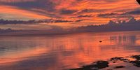 Sunsetting over Negros Oriental taken from Siquijor island, Philippines. Photographer: Alex Downes