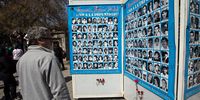 A man looks at pictures of the victims of General Pinochet's dictatorship during the traditional pilgrimage to the General Cemetery in memory of them, in Santiago, Chile, 8 September 2019. (Photo: EPA-EFE / Alberto Valdes)