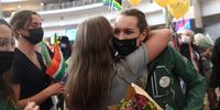 KEMPTON PARK, SOUTH AFRICA - AUGUST 02: Tatjana Schoenmaker is embraced by her fans on her arrival at OR Tambo International Airport on August 02, 2021 in Kempton Park, South Africa. It is reported that Schoenmaker won the country's first gold medal of the Tokyo Olympics by winning the 200m breaststroke in world record time. (Photo by Gallo Images/Beeld/Deaan Vivier)