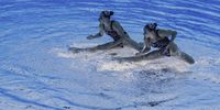 epa09388627 Lara Mechnig and Marluce Schierscher of Liechtenstein perform in the Women's Duet Free preliminary during the Artistic Swimming events of the Tokyo 2020 Olympic Games at the Tokyo Aquatics Centre in Tokyo, Japan, 02 August 2021.  EPA-EFE/Patrick B. Kraemer