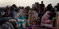 Returnees recently deported from Iran wait in the reception area at the border on July 2, 2025 in Islam Qala, Afghanistan. Over 256,000 Afghans left Iran for Afghanistan last month, according to the UN's International Organization for Migration (IOM), ahead of a July 6 deadline imposed by the Iranian government for all undocumented Afghans to leave the country. The number of Afghans in Iran had swelled in recent years after the Taliban regained control of the country in 2021. The wave of recent returns, which has been exacerbated by the recent war between Israel and Iran, are overwhelming humanitarian provisions at the border, according to the UN's refugee co-ordinator for Afghanistan. Many NGOs that provide such humanitarian relief in Afghanistan are also grappling with cuts to foreign aid budgets, most notably the cancellation of programs funded by USAID, the United States Agency for International Development. (Photo by Elise Blanchard/Getty Images)