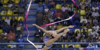 Gretel Mendoza of Cuba competes in the final ribbon event of the gymnastics rhythmic during the Central American and Caribbean Games in San Salvador, El Salvador, 03 July 2023.  EPA-EFE/Rodrigo Sura