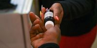 A client is handed a bottle of Methadone at a TB HIV Care drop-in centre in Cape Town, South Africa, where opioid substitution therapy along with other harm reduction services like testing, counselling and a needle exchange programme are available for people who inject drugs. (Photo: David Harrison)