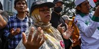 People pray during a protest against the government’s plan to evict 7,500 residents from Rempang island as part of an economic zone development plan in Jakarta, Indonesia, 20 September 2023. Authorities has announced that residents would have to move from the island in Riau Islands province, to make way for a Chinese-owned glass factory as part of an 'Eco-City' development.  EPA-EFE/MAST IRHAM