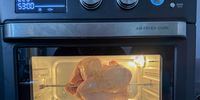 A chicken on the rotisserie in my new air fryer oven. (Photo: Tony Jackman)