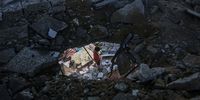 A Palestinian boy walks through ruble at a school complex for displaced Palestinians, operated by the United Nations Relief and Works Agency (UNRWA), following an Israeli strike at the Nuseirat refugee camp in central Gaza, on Thursday, June 6, 2024. The Israeli military said it conducted an airstrike on a Hamas compound embedded in a school complex complex in Gaza that eliminated militants who took part in the deadly Oct. 7 attack against Israeli civilians. Photographer: Ahmad Salem/Bloomberg via Getty Images