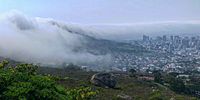 Fog rolls into Cape Town from Signal Hill. Photographer: Chris von Ulmenstein<br>