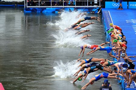Olympic triathlon races under way as Seine passes water tests, ending days of uncertainty