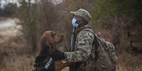 A member of the SANParks anti-poaching K9 Unit with his dog. (Photo: Shiraaz Mohamed)