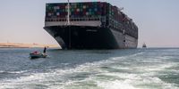 ISMAILIA, EGYPT - JULY 07: Evergreen ship is seen leaving Suez Canal to the Mediterranean after the signing of the settlement contract, on July 7, 2021 in Ismailia, Egypt. The ship had become lodged in the canal in March, requiring a six-day salvage operation to free the vessel. The canal authority and Egyptian government detained the ship for months while they sought compensation from its owners for the economic fallout of the accident. (Photo by Roger Anis/Getty Images)