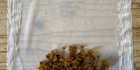 Brush three edges of the sheet with flour-water "glue" and spoon some filling near the edge nearest you.