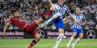 Monterrey's Rogelio Funes Mori (C) in action against Atlas' Anderson Santamaria (L), during the Liga MX soccer match between Atlas and Monterrey at the BBVA Stadium in Guadalupe, Mexico, 09 July 2023.  EPA-EFE/MIGUEL SIERRA