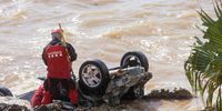 epa09442451 Firefighters inspect cars in the sea after they were dragged by floods in Les Cases d'Alcanar in Tarragona, Catalonia, Spain, 02 September 2021. Up to 77 liters per square meter of rain in half an hour was registered the previous day, causing floods in the areas of Montsia and Baix Ebre. No casualties have been reported.  EPA-EFE/Quique Garcia