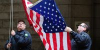 epa07126893 Deputies raise the American flag outside the Allegheny County Courthouse a day after a mass shooting at the Tree of Life synagogue in Pittsburgh, Pennsylvania, USA, 28 October 2018. Officials report 11 people were killed by the gunman identified as Robert Bowers who has been charged with hate crimes and other federal charges.  EPA-EFE/VINCENT PUGLIESE