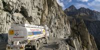 A Hindustan Petroleum Corp. tanker travels round the 'Captain Bend', where the cliff drops off close to 250 meters, on the Zojila mountain pass in Kargil district, the Union Territory of Ladakh, India, on Thursday, Sept. 23, 2021. The under construction Zojila Tunnel Project at Zojila mountain pass in the Himalayas off National Highway-01 (NH1) aims to provide quicker and all-weather connectivity to the strategic Leh-Ladakh region. Photographer: Sumit Dayal/Bloomberg via Getty Images