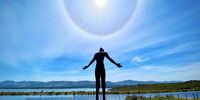 Rainbow halo at Benguela Cove on Sunday ringed the head of Anton Smit’s 7 meter bronze sculpture of a man facing heaven. Photographer: Ali McCutcheon
