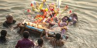 Bangladeshi devotees immerse a statue of Goddess Durga into the River Buriganga on the last day of the Durga Puja festival, in Dhaka, Bangladesh, 13 October 2024. Bengalis all over the world celebrated the annual Hindu Durga Puja festival, which celebrates the goddess Durga and the triumph of good over evil.  EPA-EFE/MONIRUL ALAM