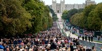 : Members of the public watch the State funeral of Queen Elizabeth II on big screens on the Long walk on September 19, 2022 in Windsor, England. The committal service at St George's Chapel, Windsor Castle, took place following the state funeral at Westminster Abbey. A private burial in The King George VI Memorial Chapel followed. Queen Elizabeth II died at Balmoral Castle in Scotland on September 8, 2022, and is succeeded by her eldest son, King Charles III. (Photo: Richard Heathcote / Getty Images)