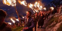 AKRE, IRAQ - MARCH 20: Iraqi Kurds carry lit torches up Kali mountain to celebrate Nowruz, the Persian new year, on March 20, 2021 in Akre, Iraq. The Persian New Year is an ancient Zoroastrian tradition celebrated by Iranians and Kurds which coincides with the vernal (spring) equinox and is calculated by the solar calendar. (Photo by Sam Tarling/Getty Images)