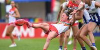 Julie O'Sullivan of the Swans is tackled by Vikki Wall of the Kangaroos during the round seven AFLW match between North Melbourne Kangaroos and Sydney Swans at North Hobart Oval, on October 13, 2024, in Hobart, Australia. (Photo by Steve Bell/AFL Photos/via Getty Images)