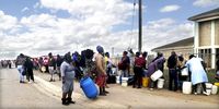Community members line up to fetch water from the Gift of the Givers truck. (Photo: Supplied)