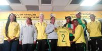 Members of Banyana Banyana's technical team present Gauteng MEC for Sport, Arts, Culture and Recreation, Mbali Hlophe with a signed team jersey at the OR Tambo International Airport Media Room. Photo by Yanga Sibembe