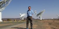 Professor Justin Jonas of Rhodes University among the radio telescopes he helped design and make functional. Image: Chris Marais