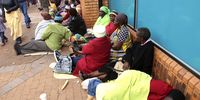 VBS Mutual Bank customers queue outside a branch  in Thohoyandou on 20 June 2018, hoping to withdraw money they saved for stokvels and burial societies. (Photo: Gallo Images / Sunday Times / Antonio Muchave)