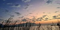 Sunrise over Hartbeespoort Dam. On my way to work, taken with my cell phone, from the moving car. Image: Drikus Bosman