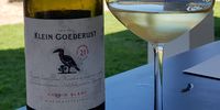The wine label of the chenin blanc shows the Klein Goederust farm logo, a Southern ground hornbill and a fleur de lys. (Photo: Kit Heathcock)