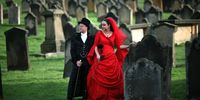 WHITBY, UNITED KINGDOM - OCTOBER 27:  Goths Tony and Angela Lightowler pose for wedding pictures after renewing their marriage vows at St Mary The Virgin Church during Whitby Gothic Weekend on 27 October, 2007, Whitby, England. Tony and Angela of Stockton-On-Tees were married two and a half years ago but decided to take their vows again during Whitby Gothic Weekend with themselves and their guests dressed in Gothic clothing. Whitby Gothic Weekend, which started in 1994 to celebrate all things dark and mysterious, has now grown to a twice yearly event for Goths. Whitby was partly chosen because Bram Stoker wrote his famous Dracula story in the fishing town with the Gothic Whitby Abbey as his inspiration. The weekend has now grown from providing a few bands to include followers of Romanticism and Dracula.  (Photo by Christopher Furlong/Getty Images)